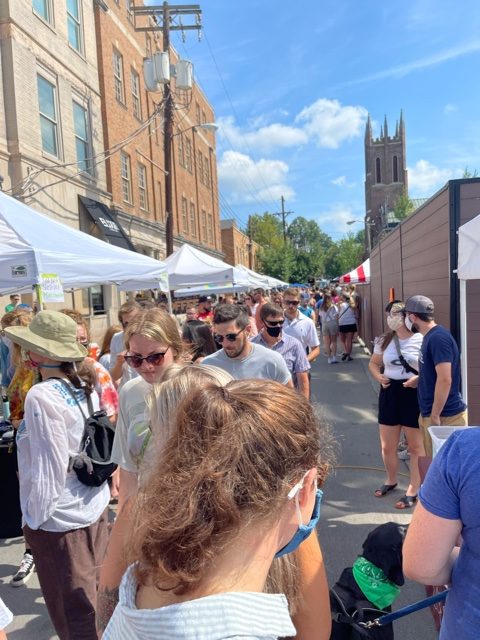 View of Market Street with Vendor Tents on Left side a throngs of people on right side during the 2021 Cold Brew Coffee Festival.